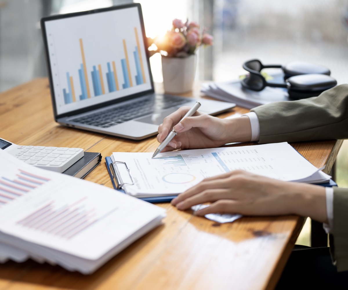 Reviewing financial reports at a desk